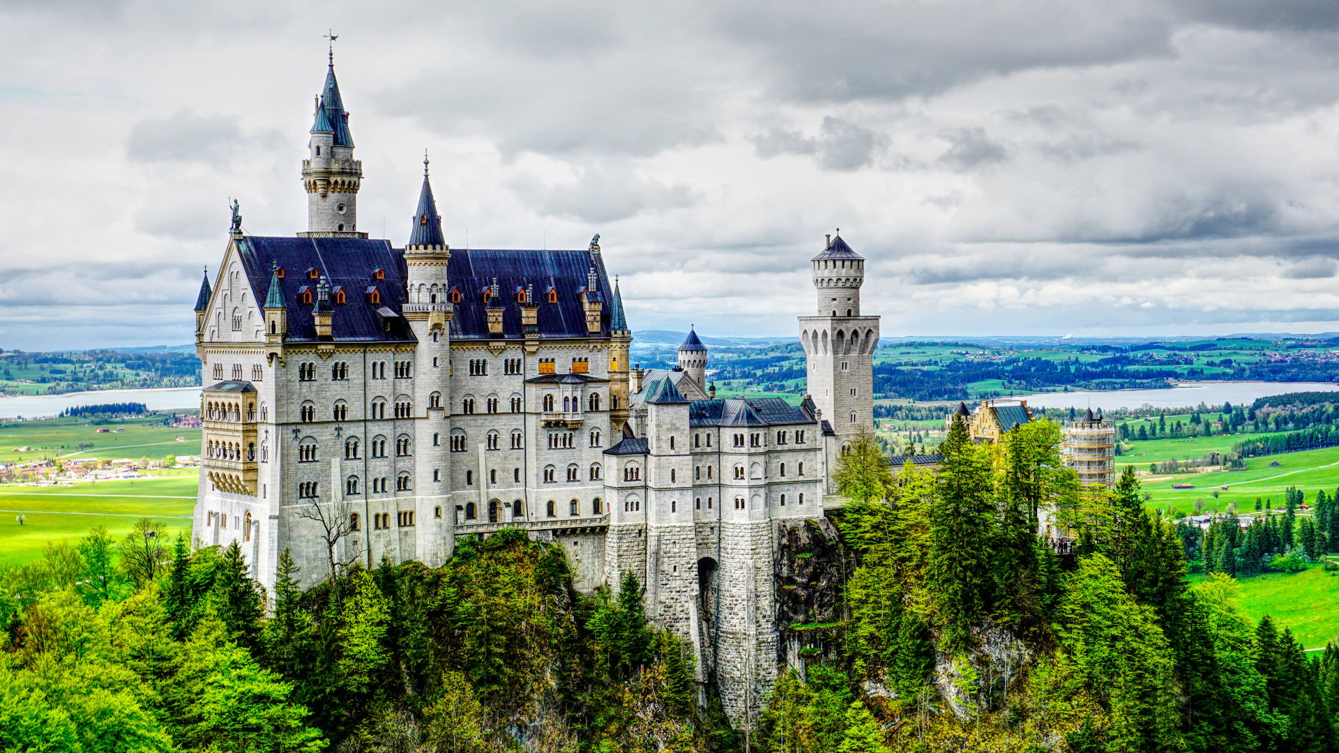 Neuschwanstein Castle in the Bavarian Alps - iconic fairy tale castle surrounded by alpine forests